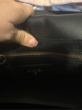 CHANEL Black Leather Shoulder Bag with Gold-Tone Zipper Interior